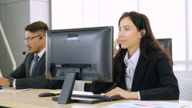 Business professionals managing business phone number porting to a new cloud phone system in Dallas