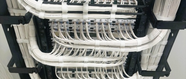 Structured cabling rack with labeled Cat6 cabling for Dallas commercial office
