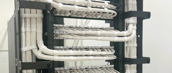 Enterprise structured cabling rack with clean cable routing for Dallas commercial client