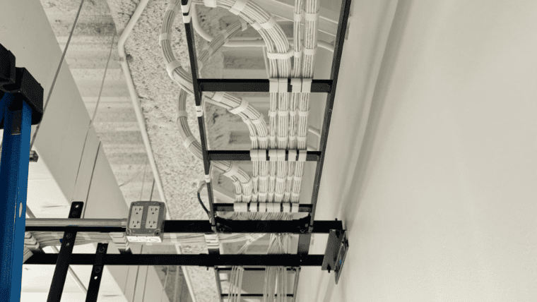 Overhead cable tray with neatly managed structured cabling.