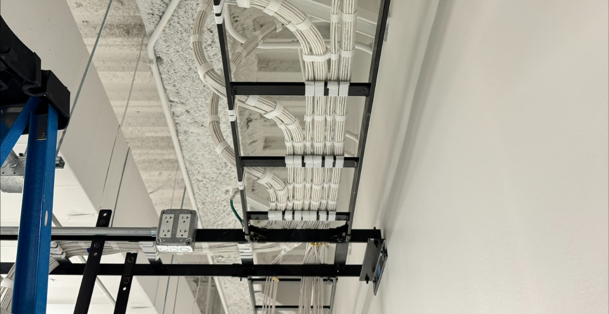 Overhead cable tray with neatly managed structured cabling.