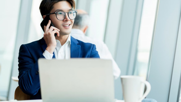 Construction company owner using mobile cloud phone system while managing projects in Dallas-Fort Worth
