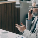 Dental practice owner using cloud phone system for patient communication in Dallas-Fort Worth office