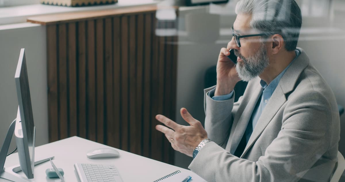 Dental practice owner using cloud phone system for patient communication in Dallas-Fort Worth office