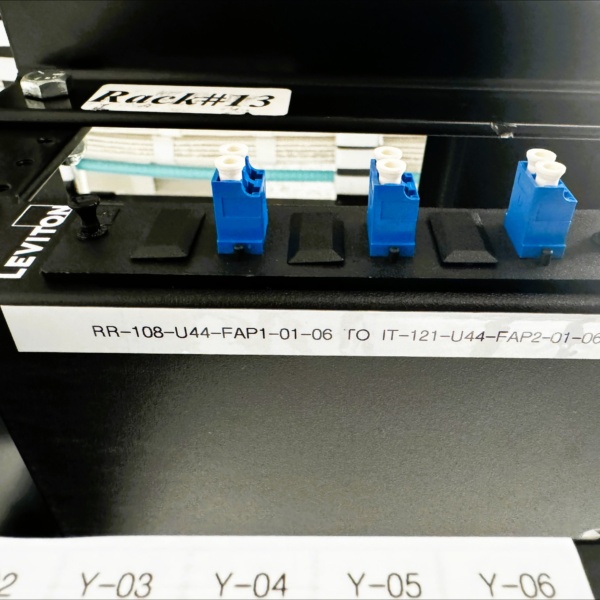 Close-up of labeled fiber connectors on Rack 13.
